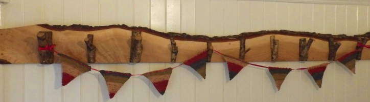 A panel of oak hooks with bunting.