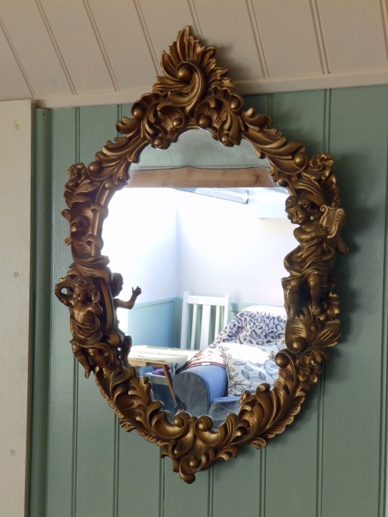 The ornate lounge mirror