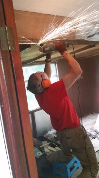 Grinding the rust off the pull-out frame