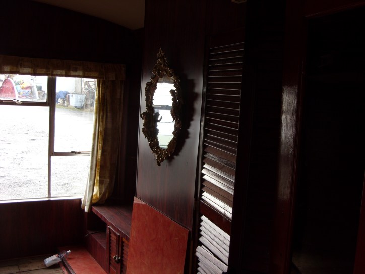 The dark wood of the original lounge