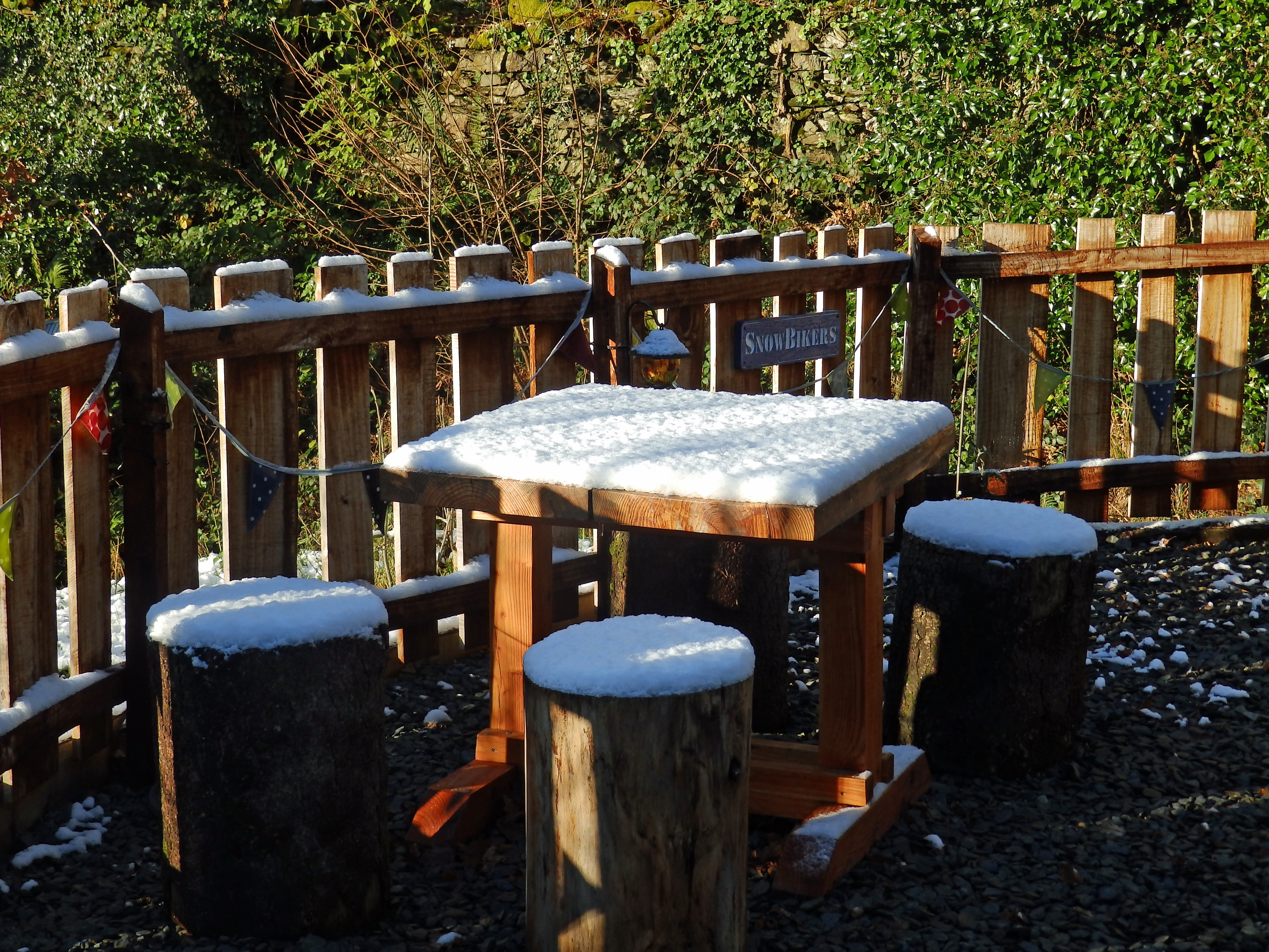 Snow covered table and chairs