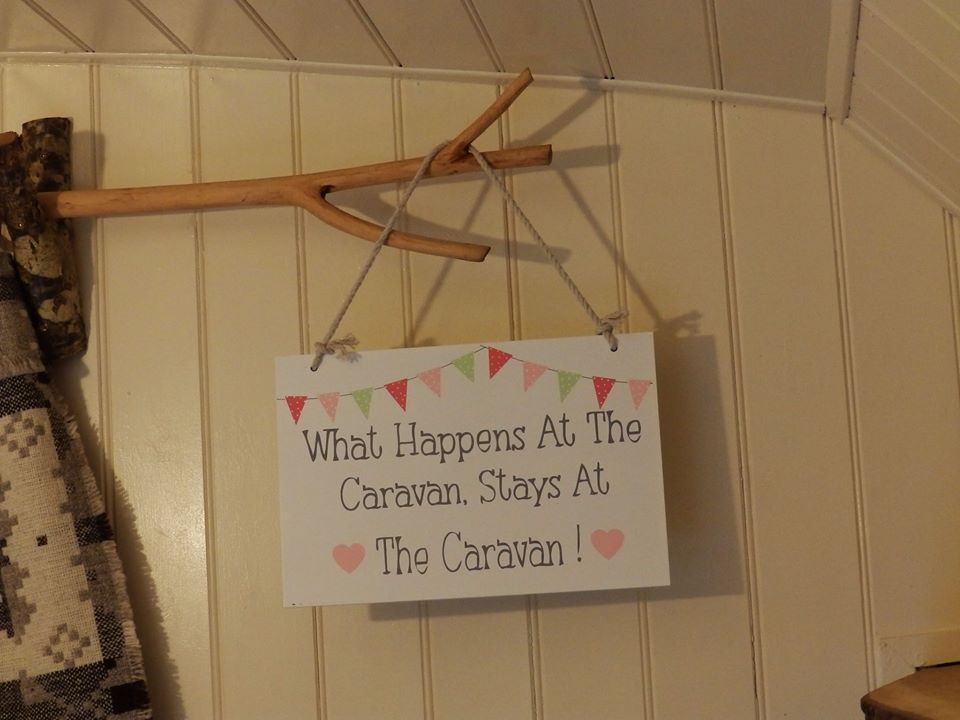 A wooden curtail rail with forked end